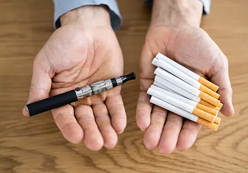 Hand Holding E- Cigarette 