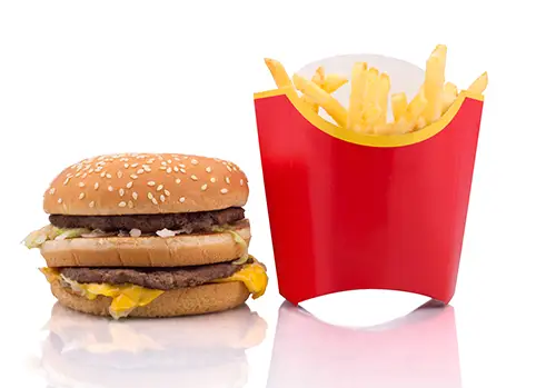 Hamburger and French fries on white background 