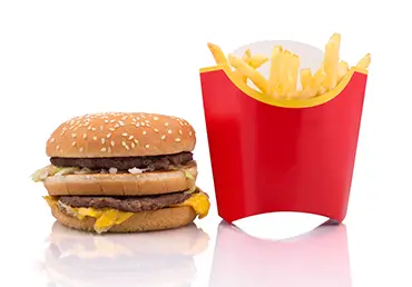 Hamburger and French fries on white background