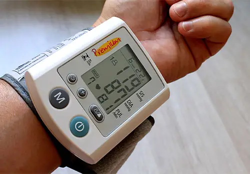 Man at the doctor's office getting their blood pressure checked