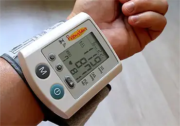 Man at the doctor's office getting their blood pressure checked