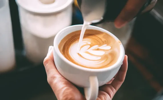 Barista pouring coffee in a cup, how much caffeine is too much