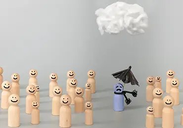 Depressed sad person with a cloud overhead, surrounded by happy people on grey background
