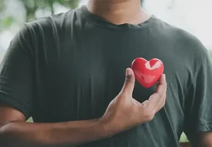 Hand holding red heart, World health day, Health care and mental health concept, Health insurance, Charity volunteer donation, CSR responsibility, World heart day, Self love
