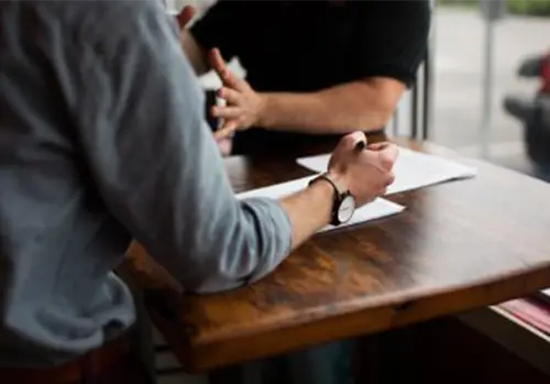 two men reviewing documents