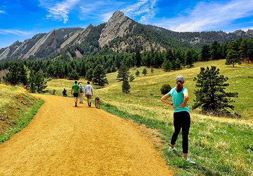 In Colorado, a woman in good health stares at mountains.