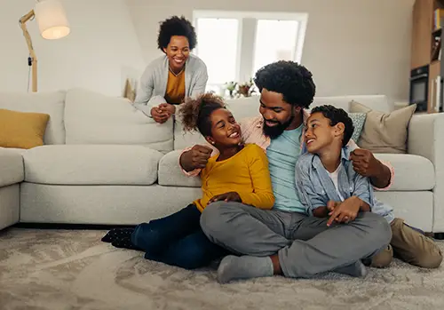 Young family hangs out in their living room.