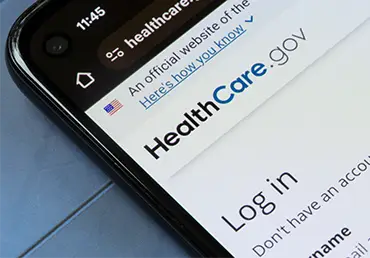 smartphone with the homepage of healthcare.gov