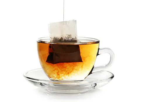 Cup with bag of tea.